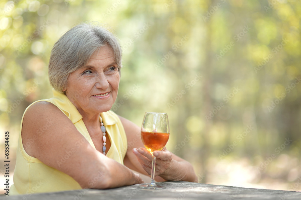 Old woman drinking wine Old woman drinking wine