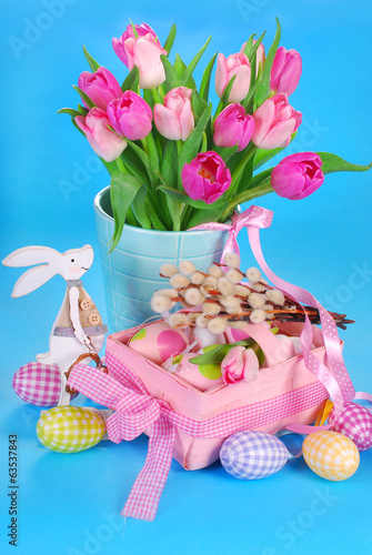 easter decoration with wooden bunny and fresh tulips