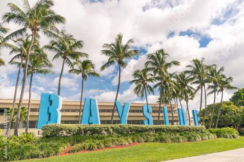 Bayside capital letters sign and Palm trees in Miami Florida