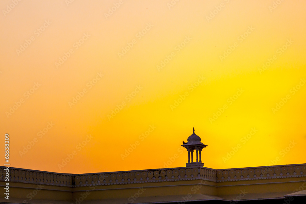 Sunset with view to a top of a small temple in Jaipur
