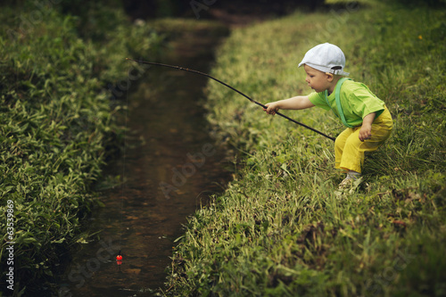 photo of little boy fishing © Aliaksei Lasevich