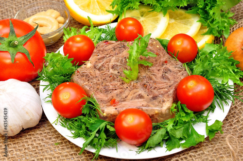 jellied meat with fresh herbs and cherry tomatoes © Basthamp