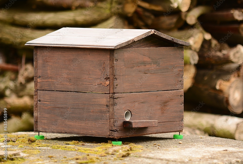 Home made decorative bumblebee nest from the wood in the garden. Home made decorative bumblebee nest from the wood in the garden.