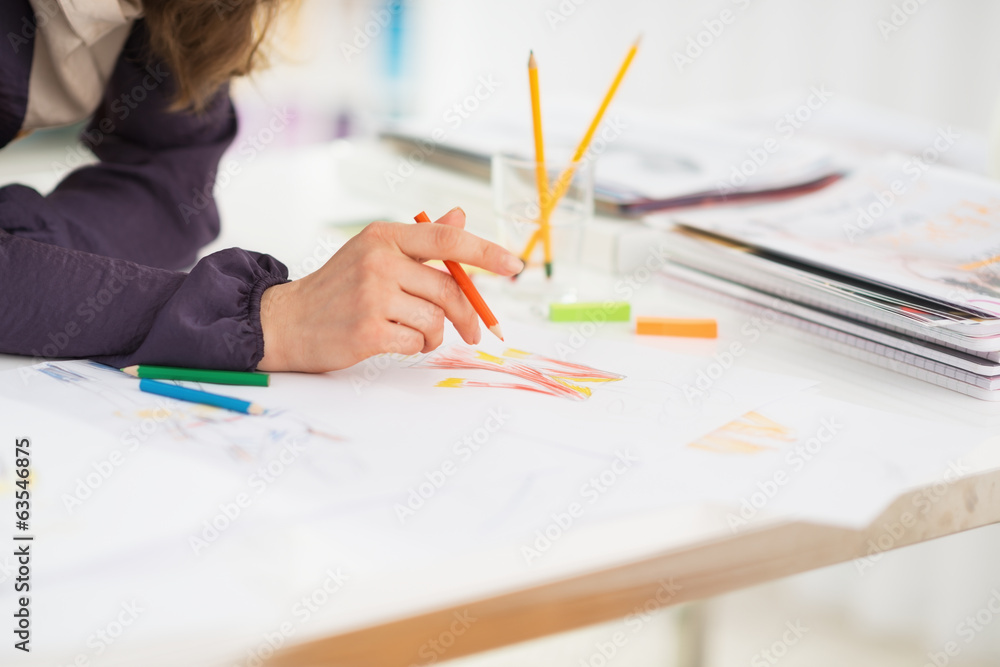 Closeup on fashion designer making sketches Closeup on fashion designer making sketches
