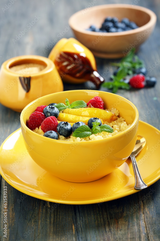 Bowl of porridge, fruit and berries. Bowl of porridge, fruit and berries.