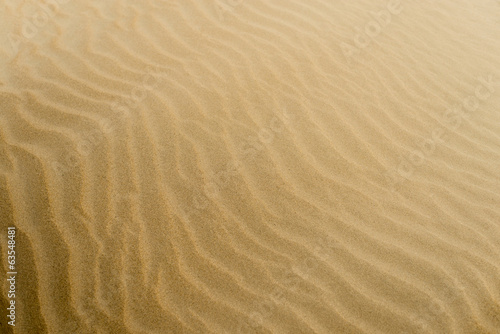 Soft sand textured background. Yellow color.