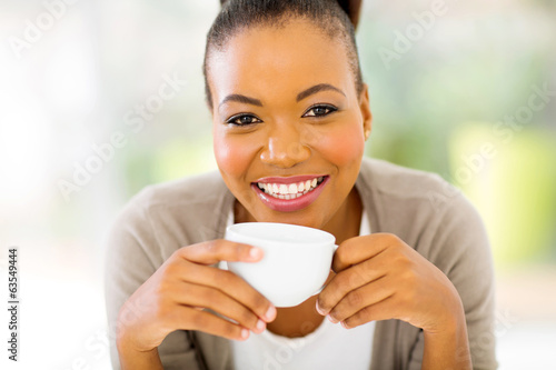 african woman drinking coffee in the morning