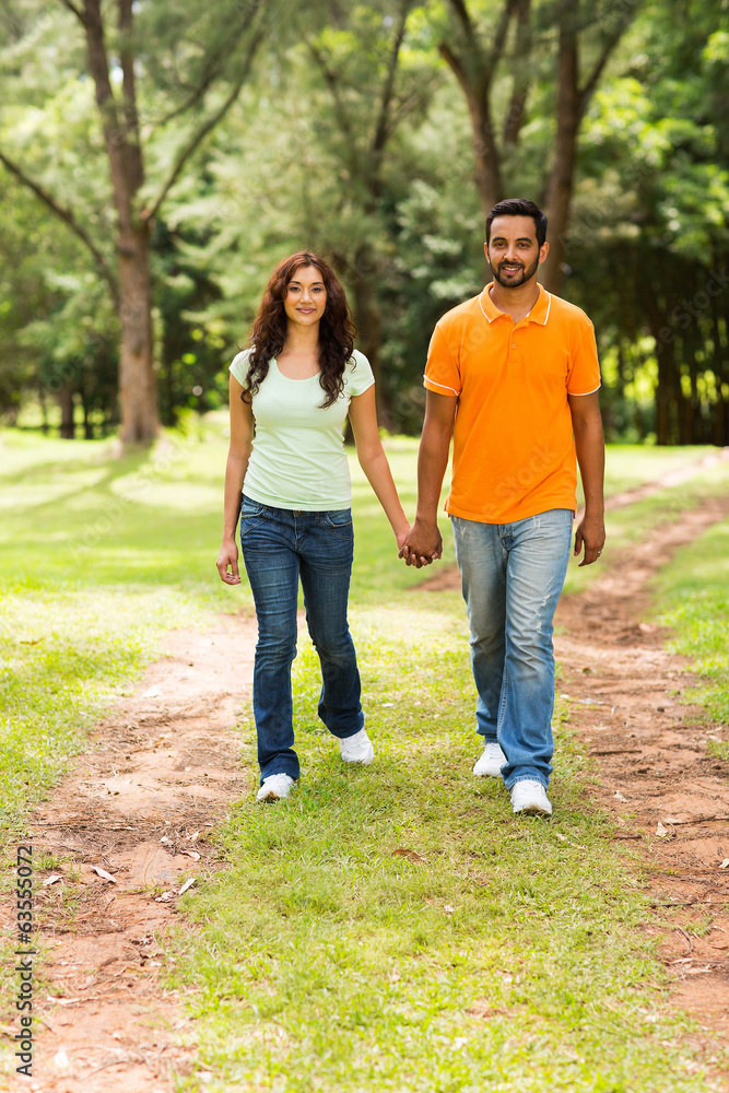 young indian couple walking outdoors young indian couple walking outdoors