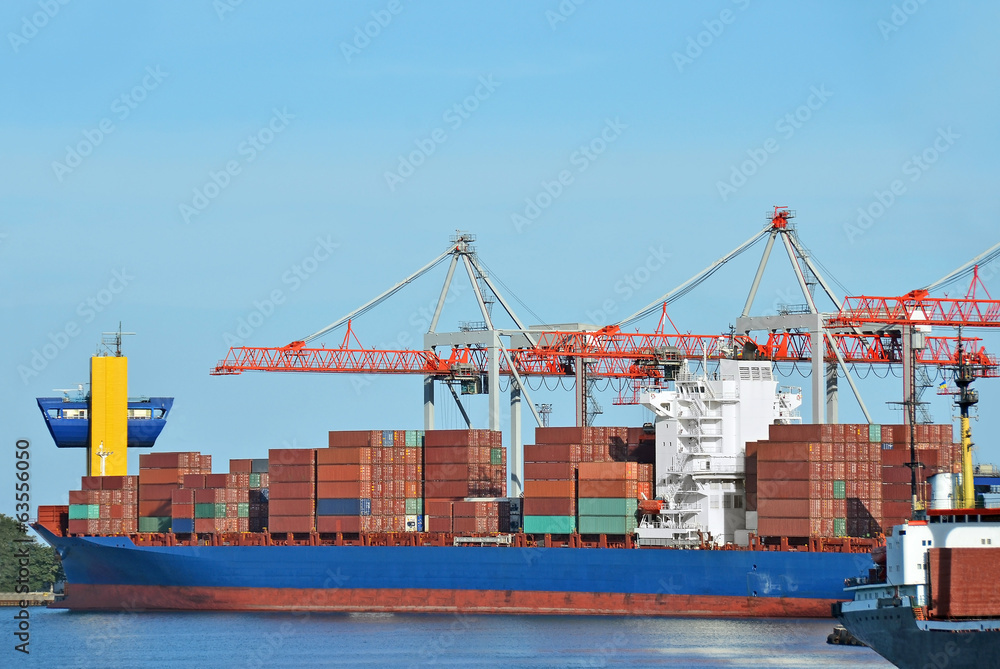 Container stack and ship under crane bridge Container stack and ship under crane bridge
