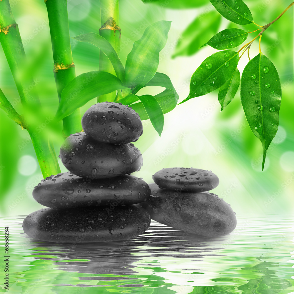spa Background - black stones and bamboo on water spa Background - black stones and bamboo on water