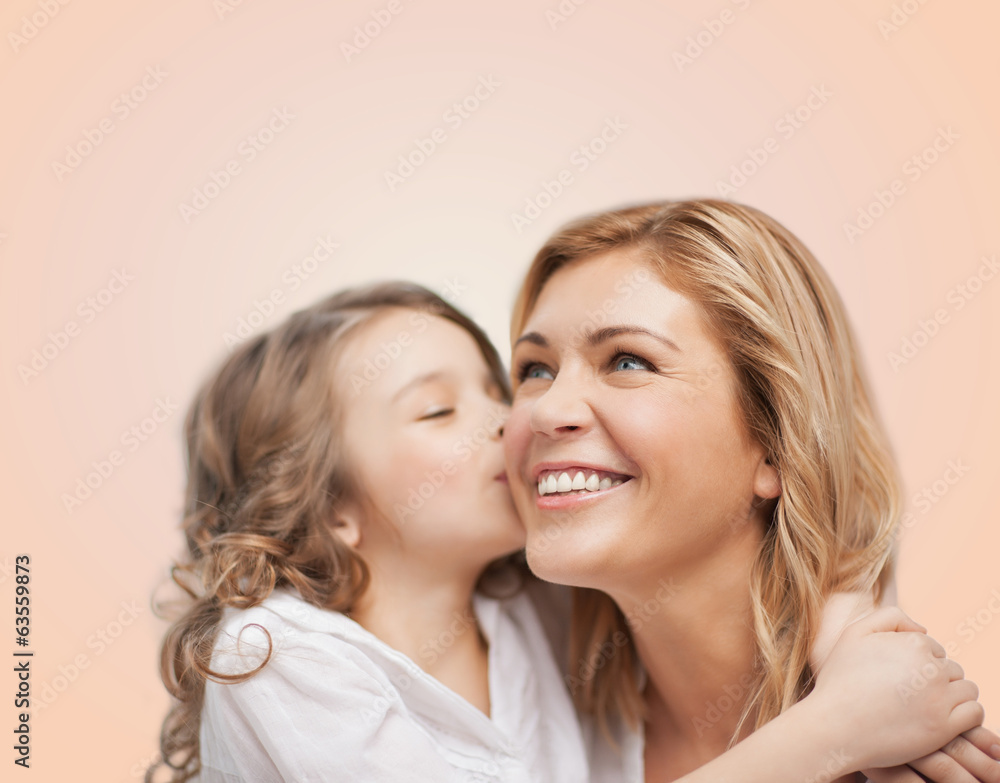 smiling mother and daughter hugging smiling mother and daughter hugging