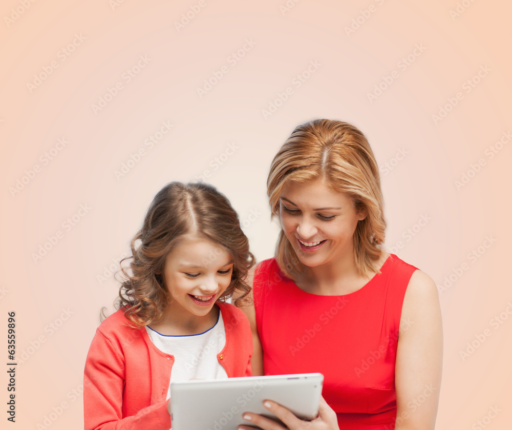 mother and daughter with tablet pc computer mother and daughter with tablet pc computer