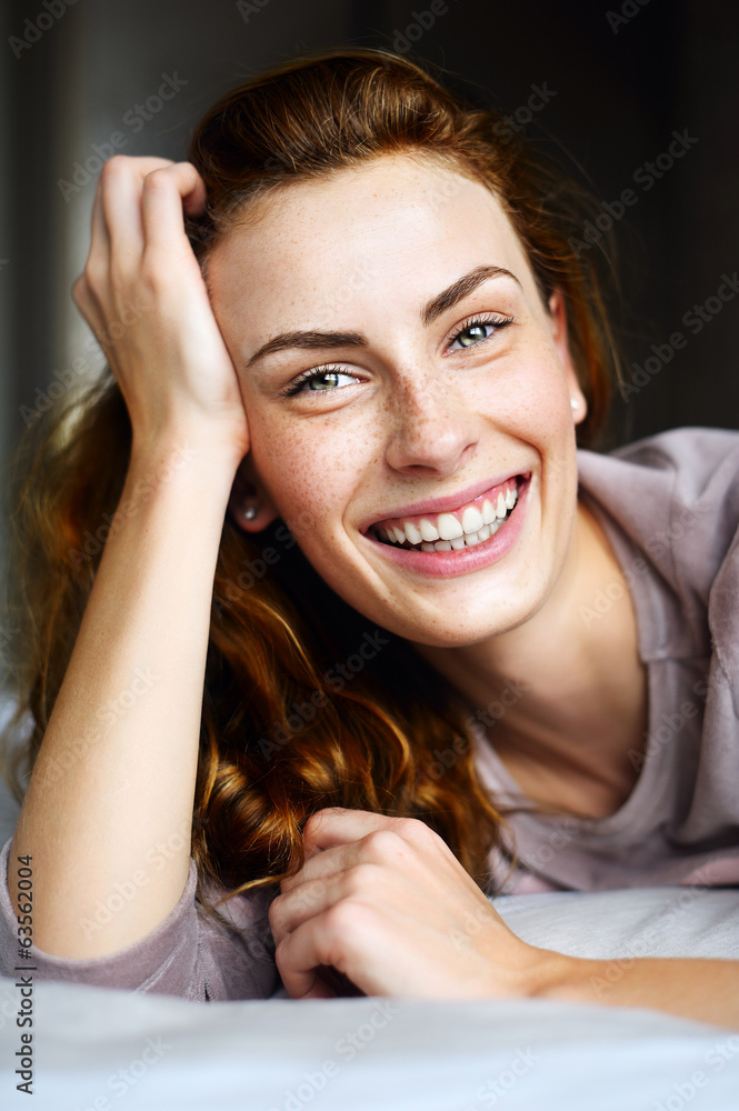 Fototapeta premium Portrait of charming beautiful girl in bed