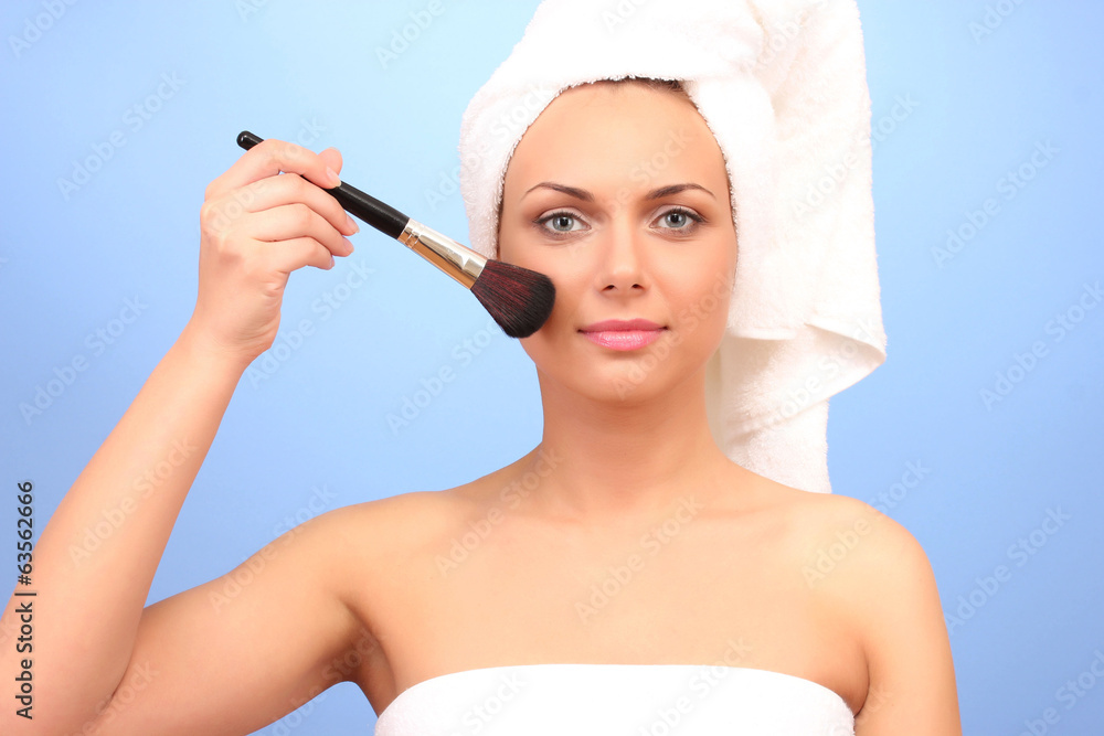 Beautiful young woman after shower with a towel Beautiful young woman after shower with a towel