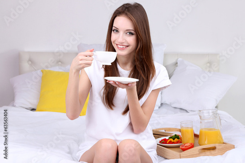Young beautiful woman on be...