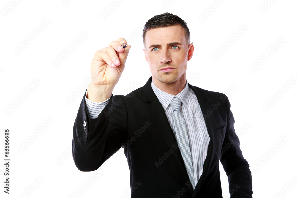 Handsome businessman writes with pen at copyspace Handsome businessman writes with pen at copyspace