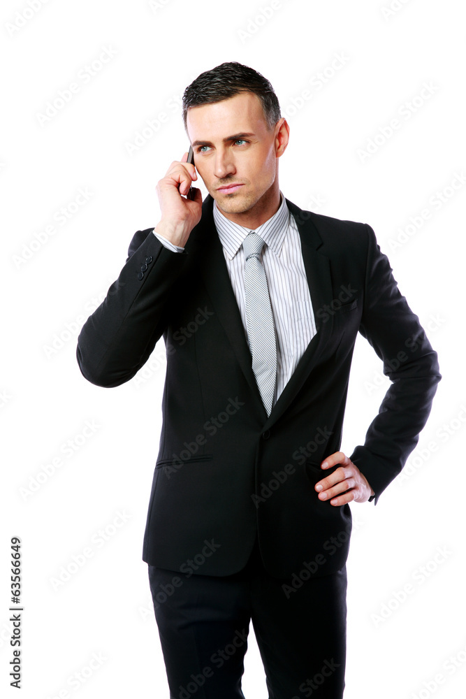 Handsome businessman talking on the phone over white background Handsome businessman talking on the phone over white background