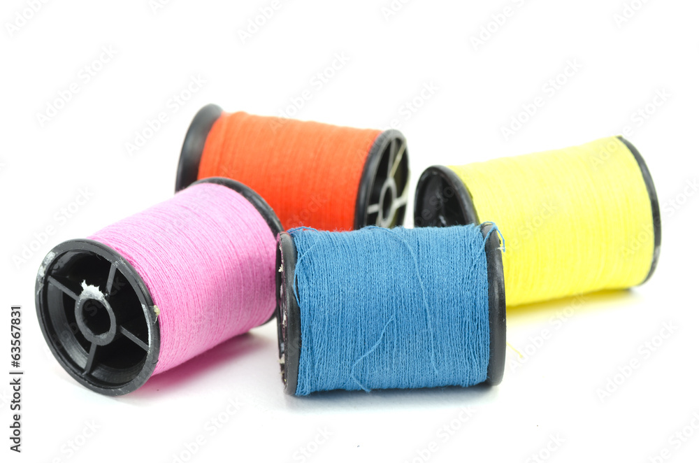 colorful sewing Threads isolated on white background colorful sewing Threads isolated on white background