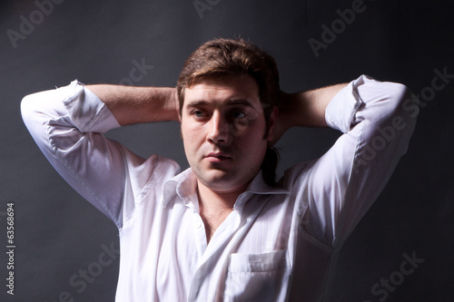 man posing in white shirt © Volodymyr Khodaryev