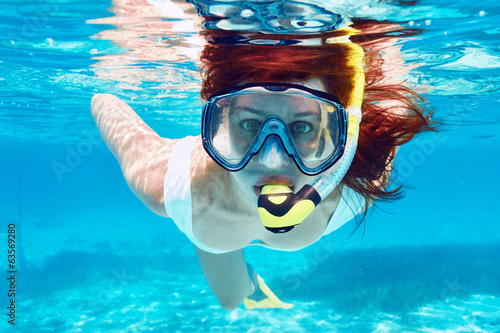 Woman with mask snorkeling