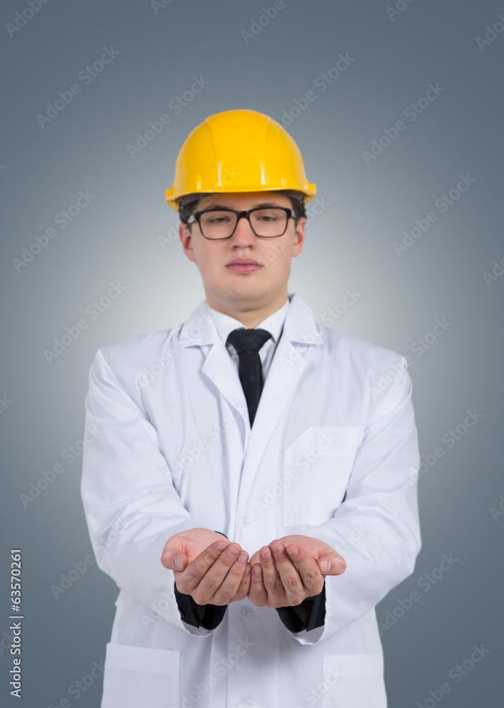 A man in a white robe and an yellow cap, white background. A man in a white robe and an yellow cap, white background.