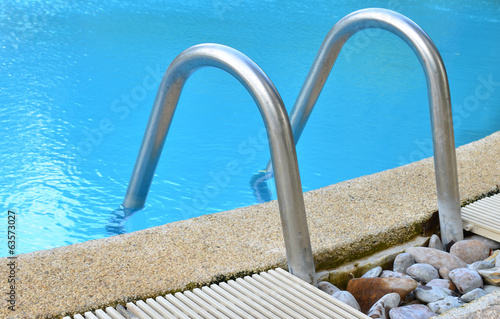 Swimming pool with stair at...