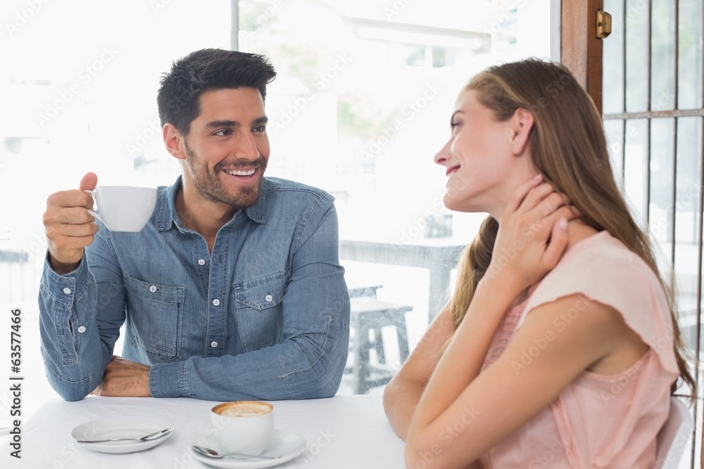 Portrait of a smiling couple at coffee shop