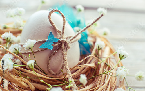 Photography Easter egg in nest, rustic easter decoration card.