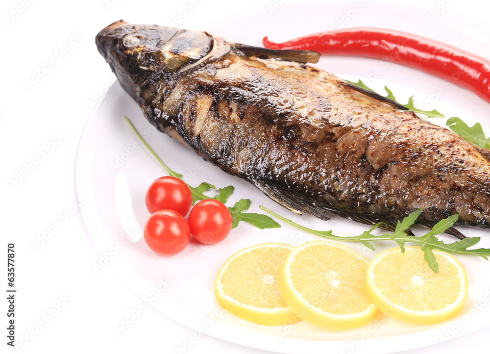 Fried carp with lemon and rukkola. Fried carp with lemon and rukkola.