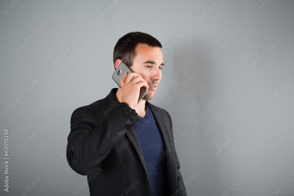 isolated portrait of a young executive man on plain background isolated portrait of a young executive man on plain background