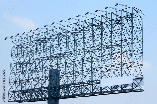steel structure billboard with light on blue sky background