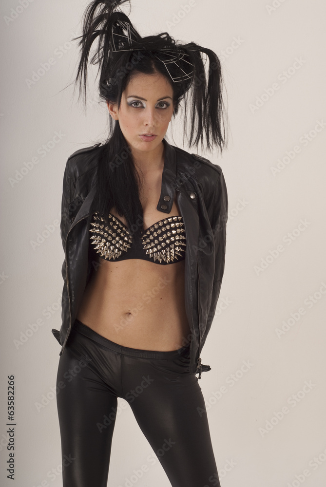 Naklejka premium Beautiful girl posing in a leather jacket