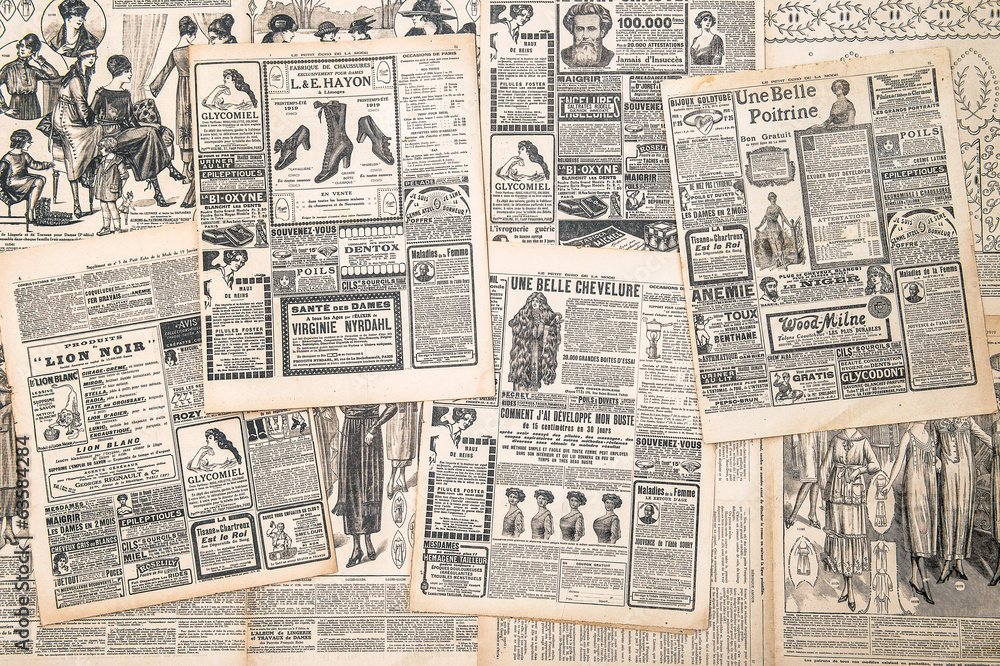 newspaper pages with antique advertisement