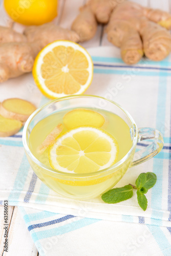 Healthy ginger tea with lemon and honey on table close-up