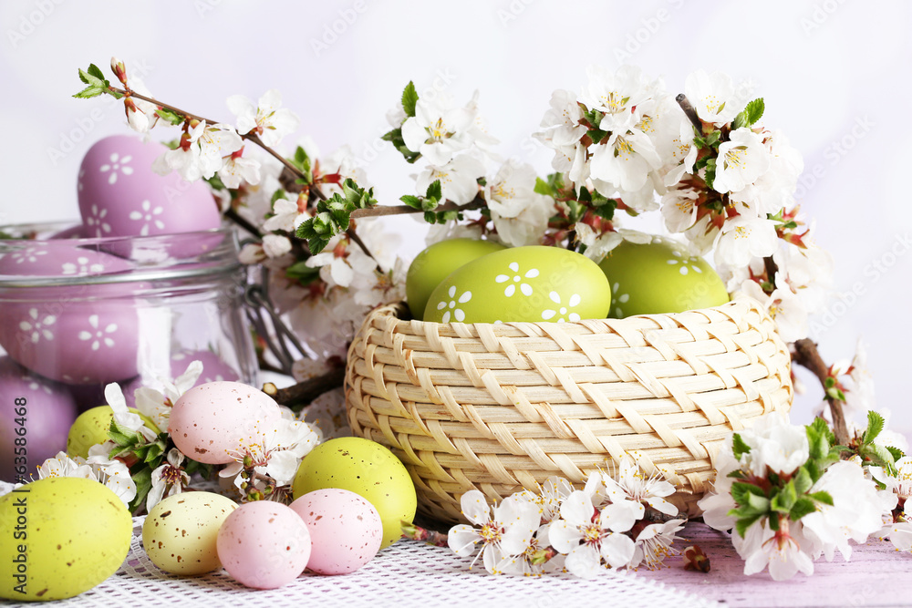 Composition with Easter eggs in glass jar and wicker basket, - obrazy, fototapety, plakaty 