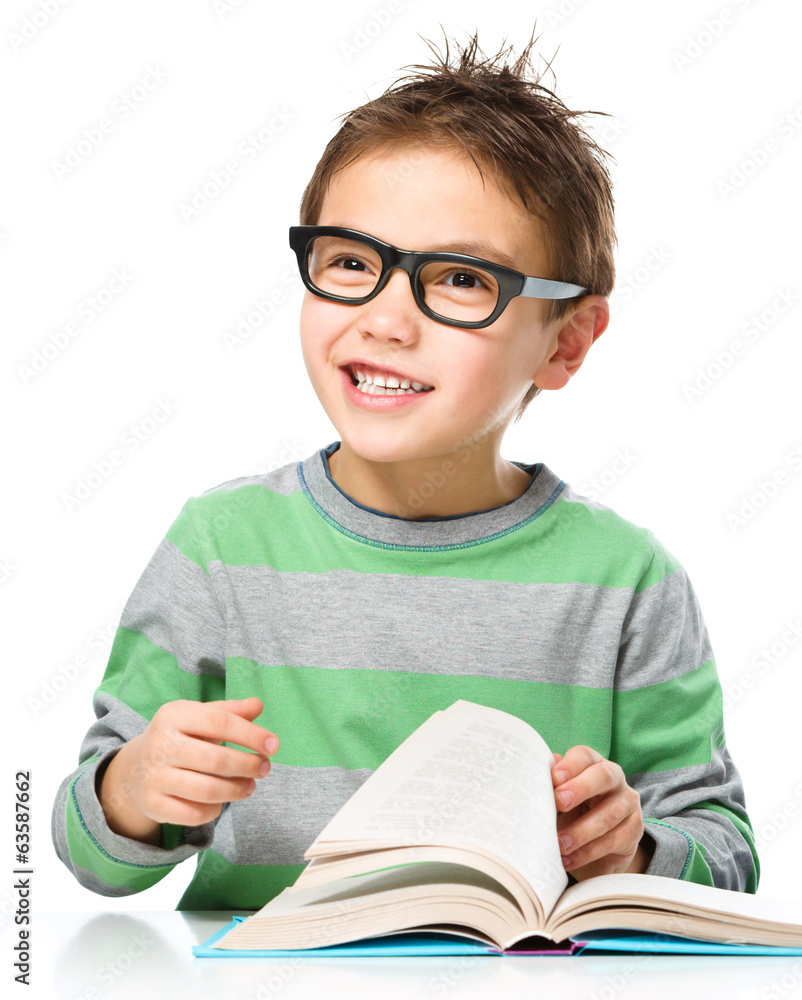 Little boy is reading a book Little boy is reading a book