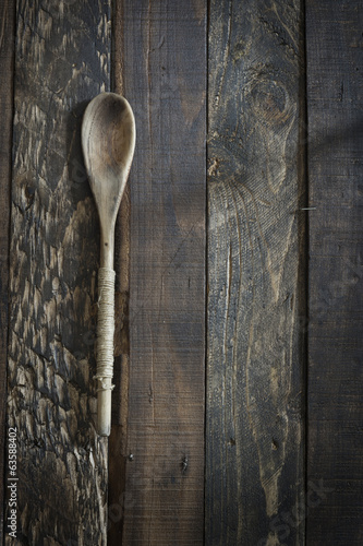 Wooden kitchenware on gbrown background