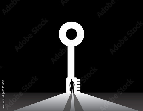 Businessman silhouette standing front of key door concept
