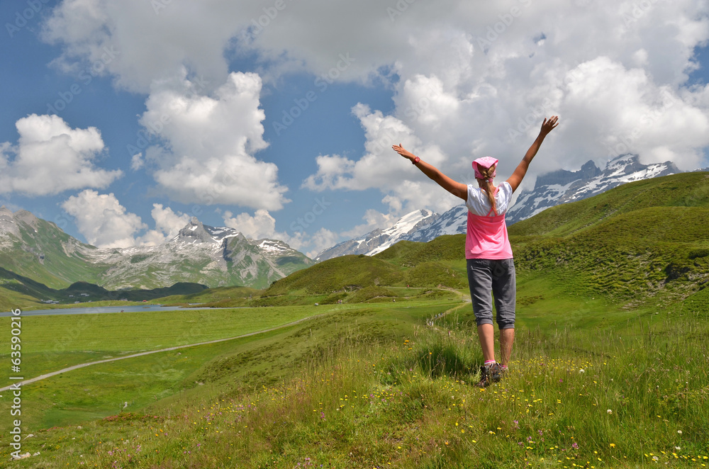 Traveler on the hill. Melchsee-Frutt, Switzerland Traveler on the hill. Melchsee-Frutt, Switzerland
