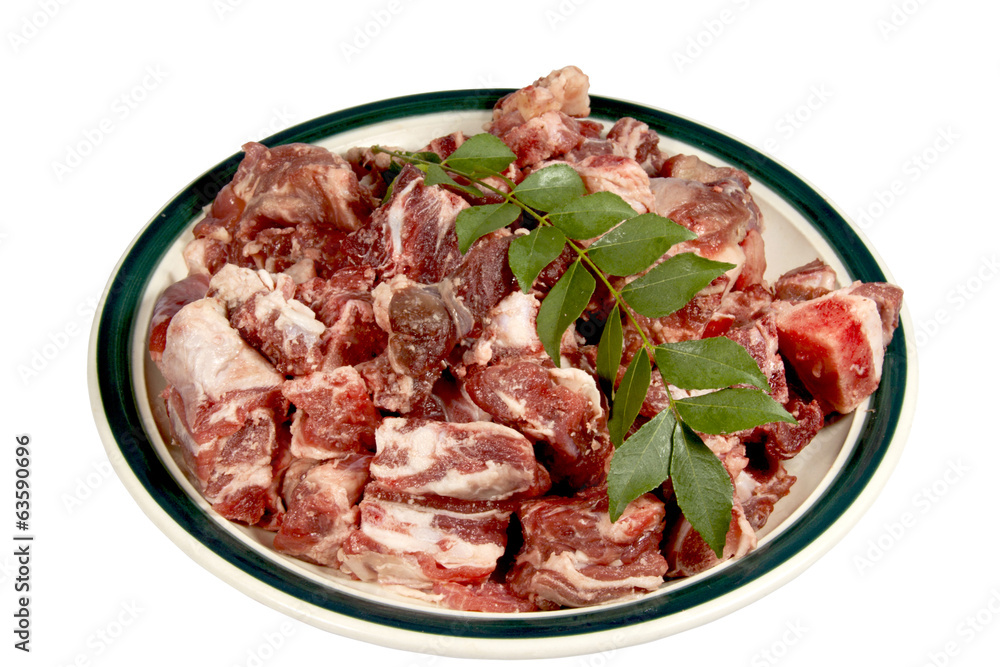Cubes of Lamb with Sprig of Curry Leaves Ready for Cooking