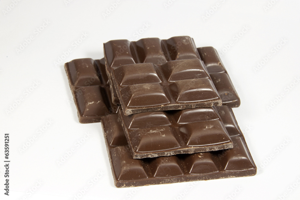 Obraz premium Stacked Broken Slab of Dark Chocolate Squares