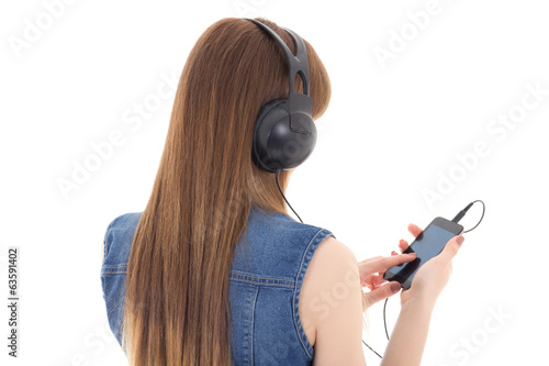 young woman listening music with mobile phone isolated on white