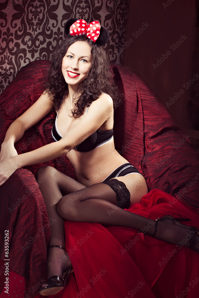 Brunette pin up model posing dressed in underwear and bow of Minnie Mouse  Stock Photo | Adobe Stock