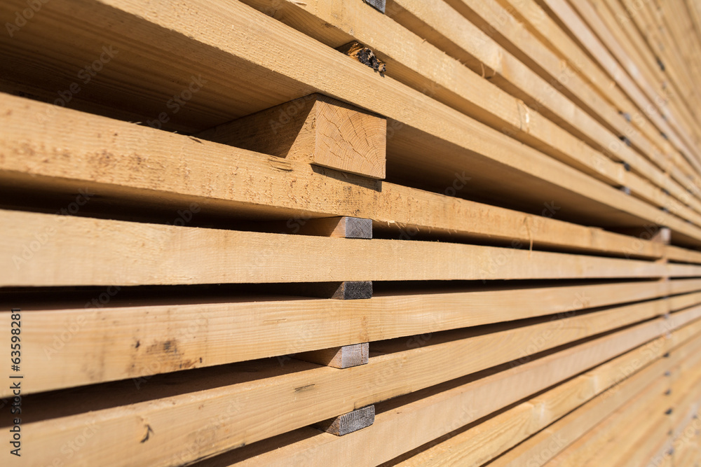 Stack of new wooden studs at the lumber yard Stack of new wooden studs at the lumber yard