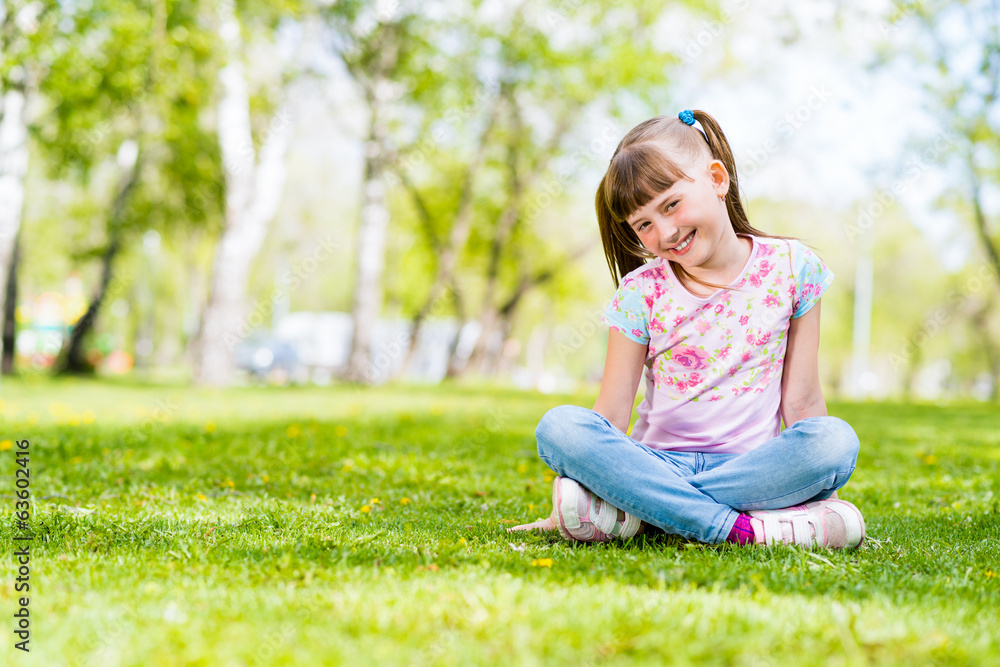 portrait of a smiling girl in a park portrait of a smiling girl in a park