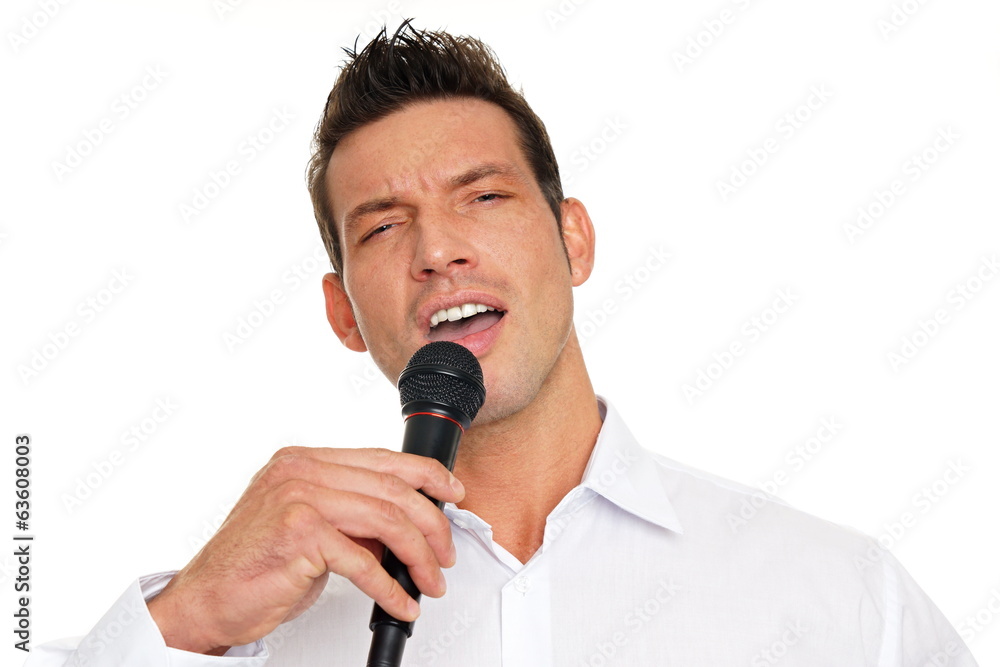 Karaoke with handsome man on isolated white background Karaoke with handsome man on isolated white background
