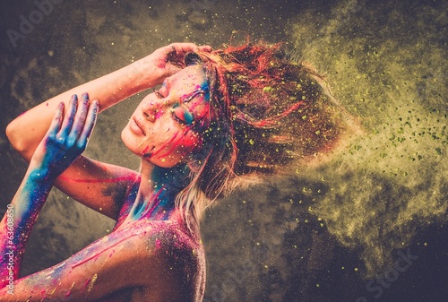 Young woman muse with creative body art and hairdo photo