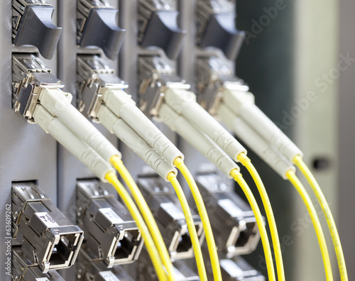Yellow optic fiber connected to switch