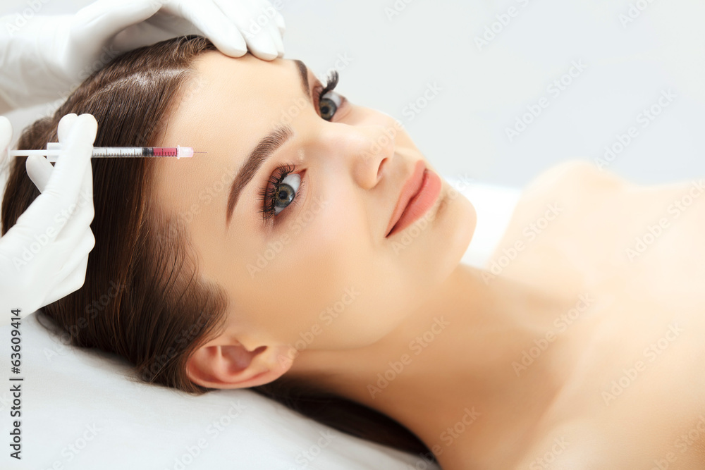 Beautiful woman gets injections. Cosmetology. Beauty Face