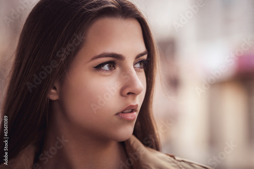 Portrait of sensual woman on city background